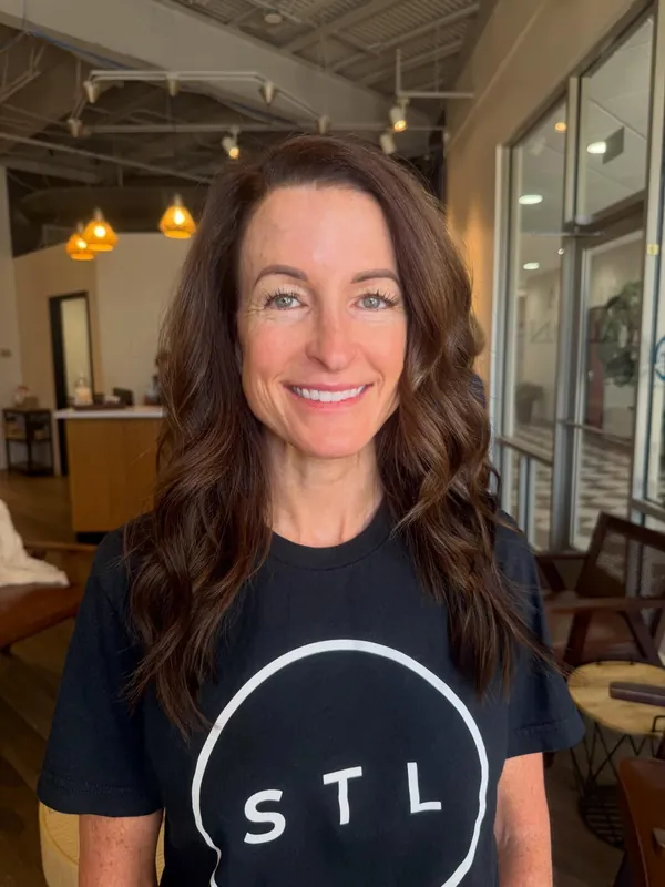 After: brunette waves with warm caramel highlights, framing the client's face